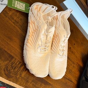 White and Orange Athletic Shoes